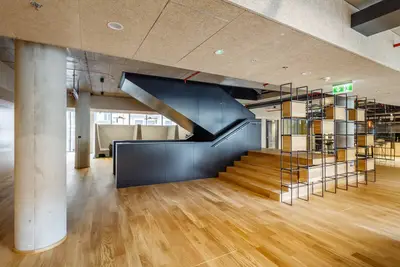The dominant interior feature is the staircase that links all floors.
